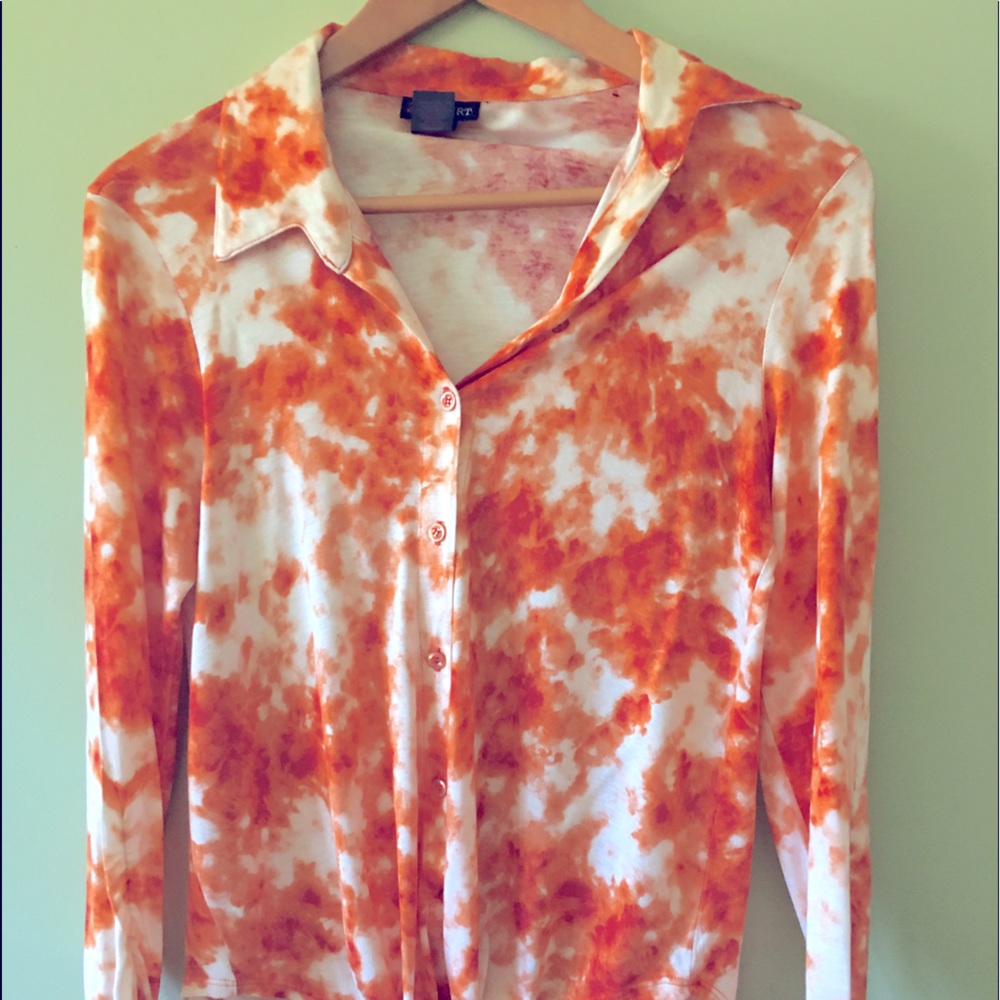 Woman’s long sleeve front tie up button down orange and white top